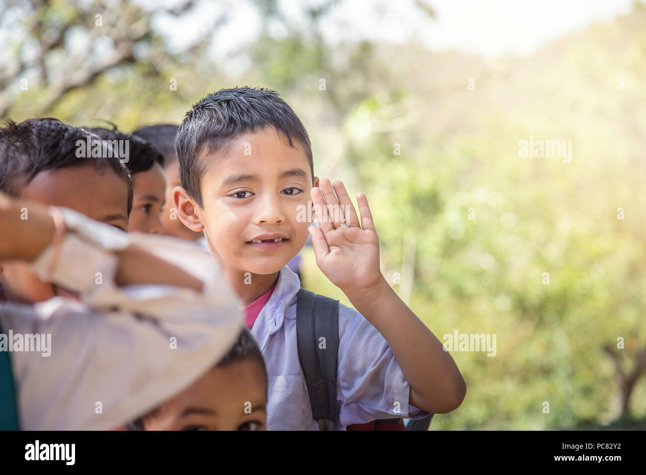 Portrait of Indian rural school Boy standing in queue during morning assembly outdoor. Stock Photo