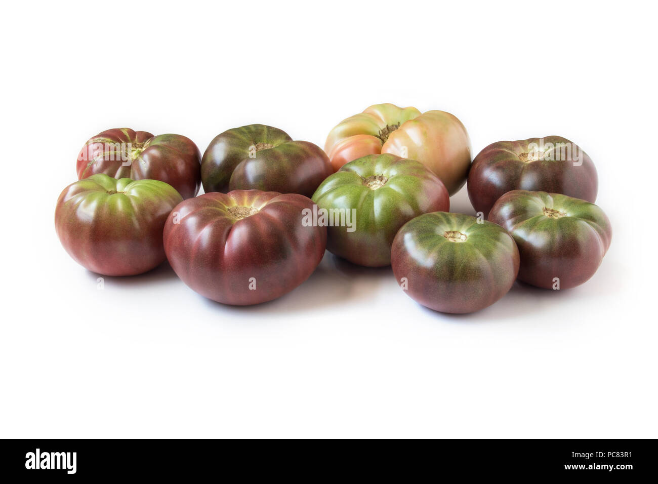 Organic heirloom Brandywine tomatoes, isolated on white Stock Photo Alamy