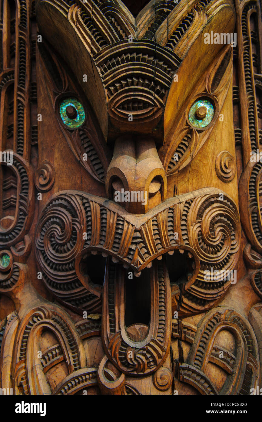 Traditional wood carved mask in the Te Puia Maori Cultural Center, Roturura, North Island, New Zealand Stock Photo