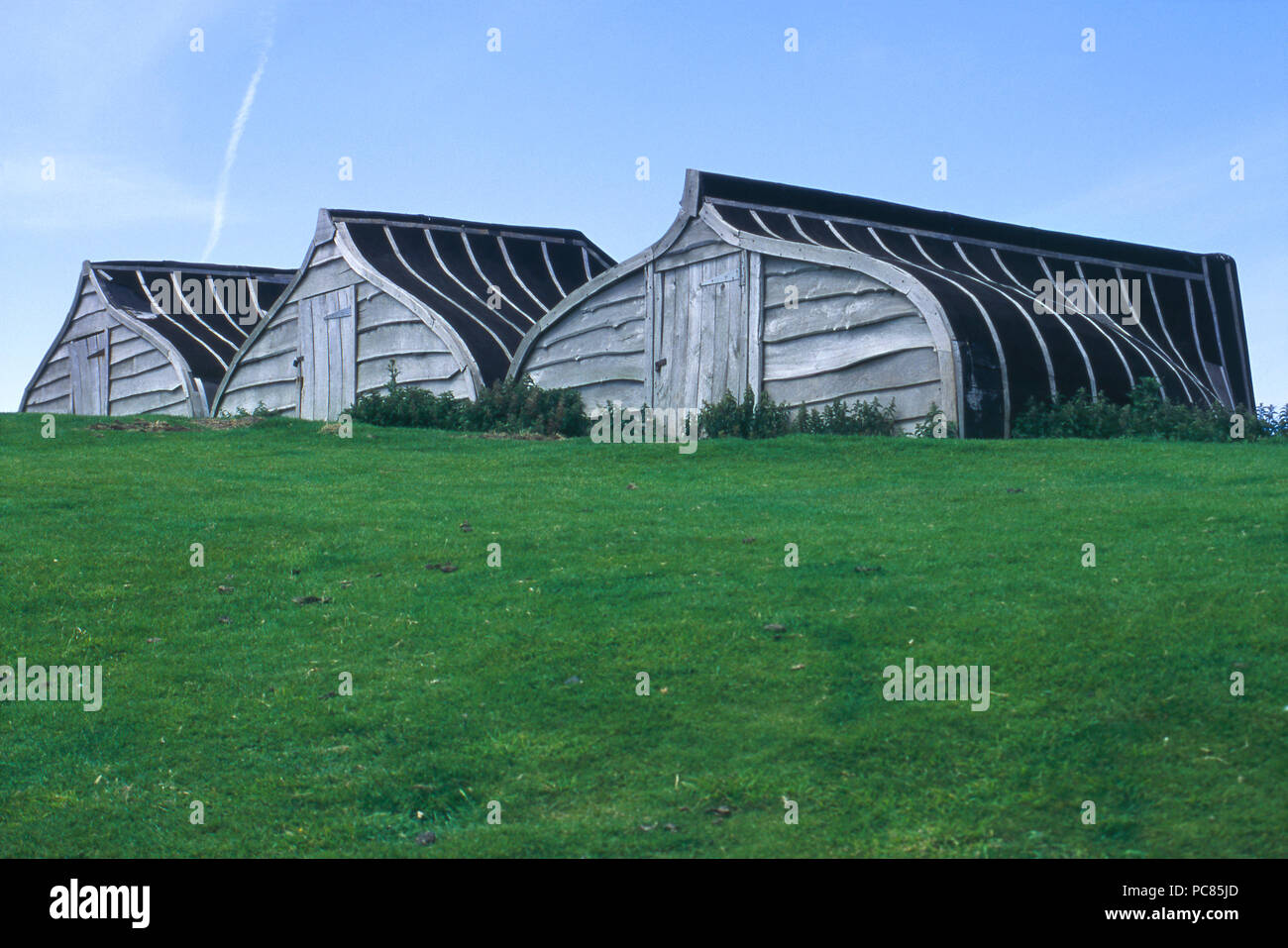Boat-hull sheds on Lindisfarne (Holy Island) on the North Sea coast of England. Photograph Stock Photo