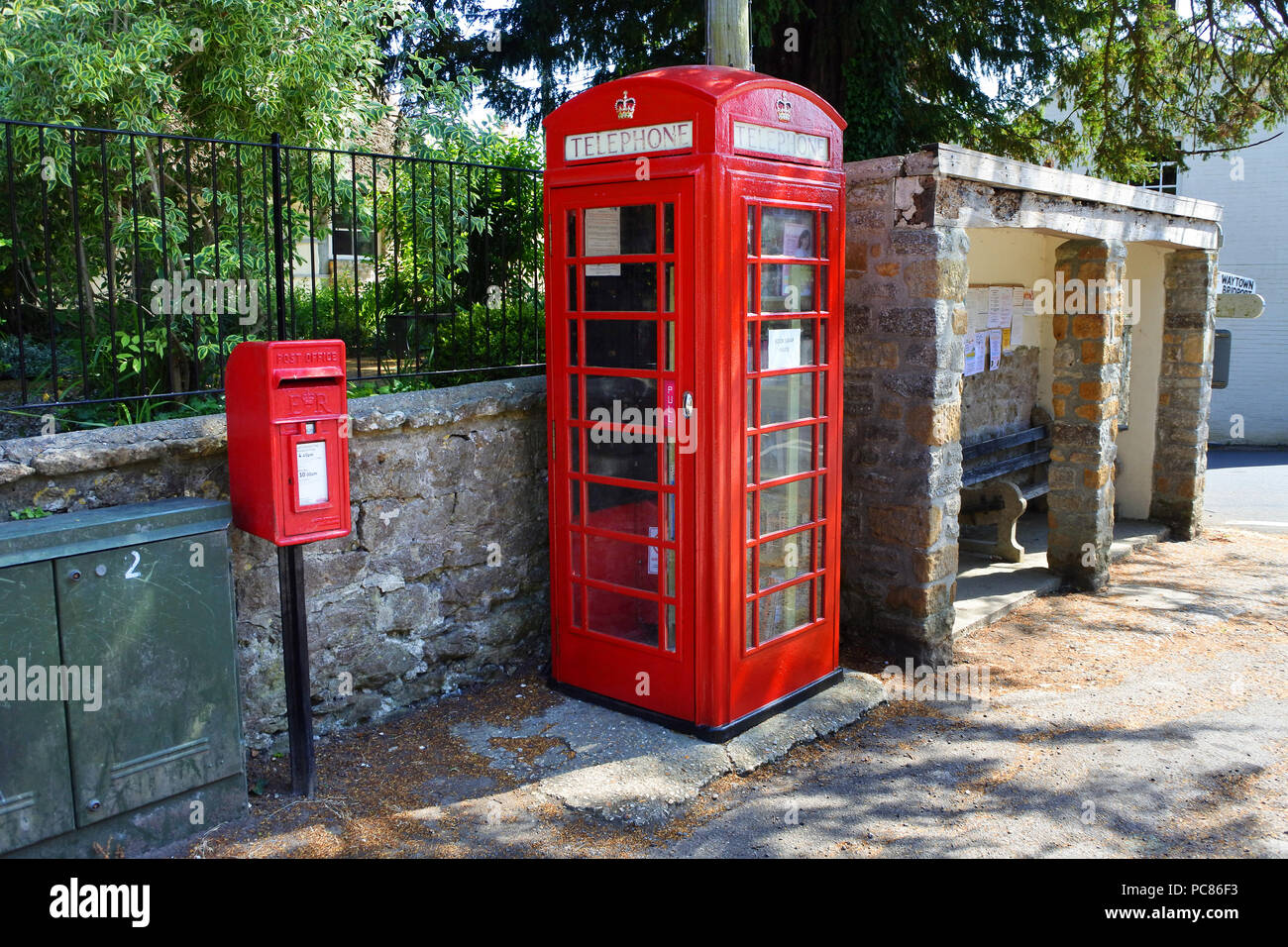 Red telephone kiosk being used as a community book exchange John