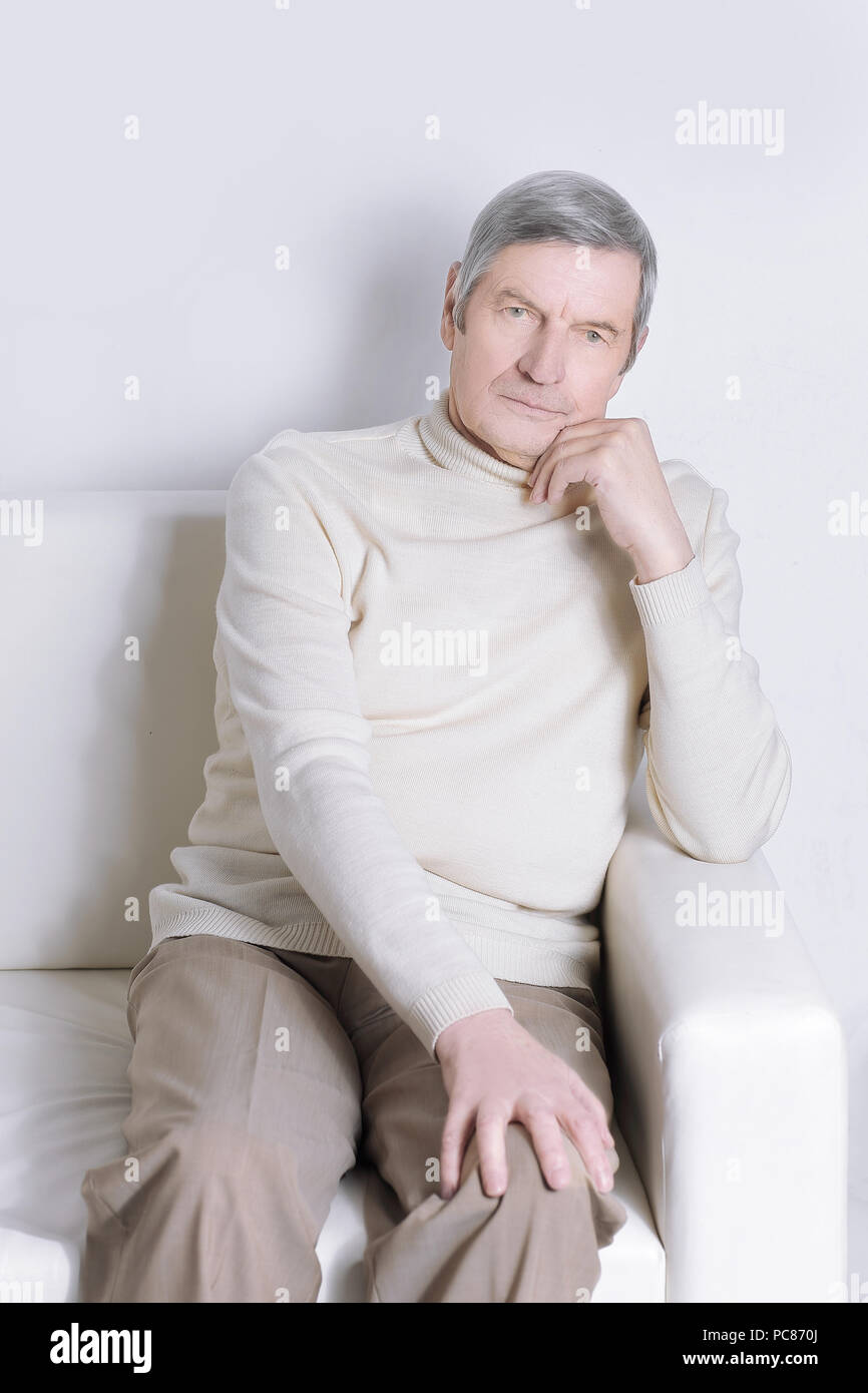 portrait of an elderly man sitting in a chair Stock Photo - Alamy