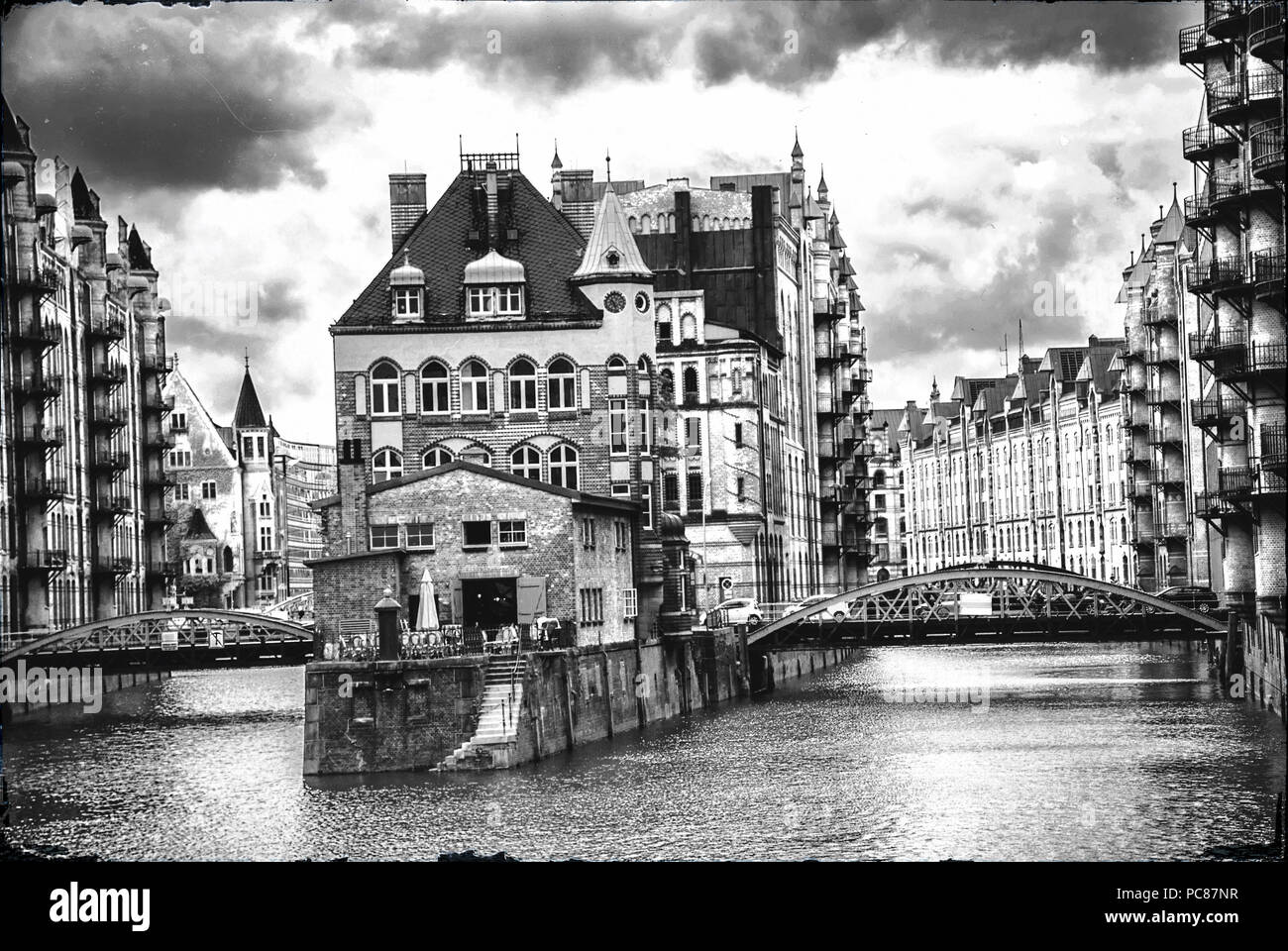 Water Castle in Hamburg's harbor city in black and white Stock Photo