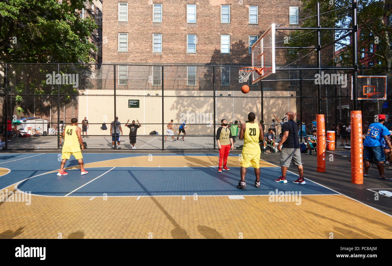 neighbors playing at The Legendary West 4th Street Basketball Court "the  cage" in the Greenwich Village, New York City Stock Photo - Alamy