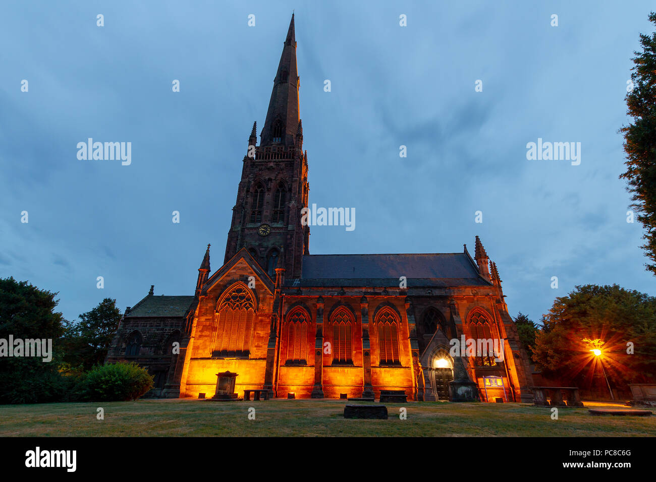 Late evening, floodlit picture of St Elphin's Parish Church, Church Street, Warrington, Cheshire, England, UK Stock Photo