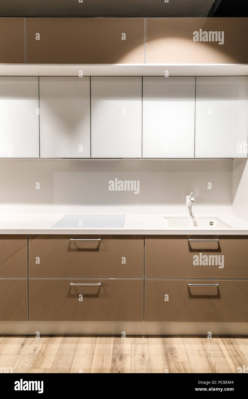 Stylish kitchen with elegant white and brown counter Stock Photo Alamy