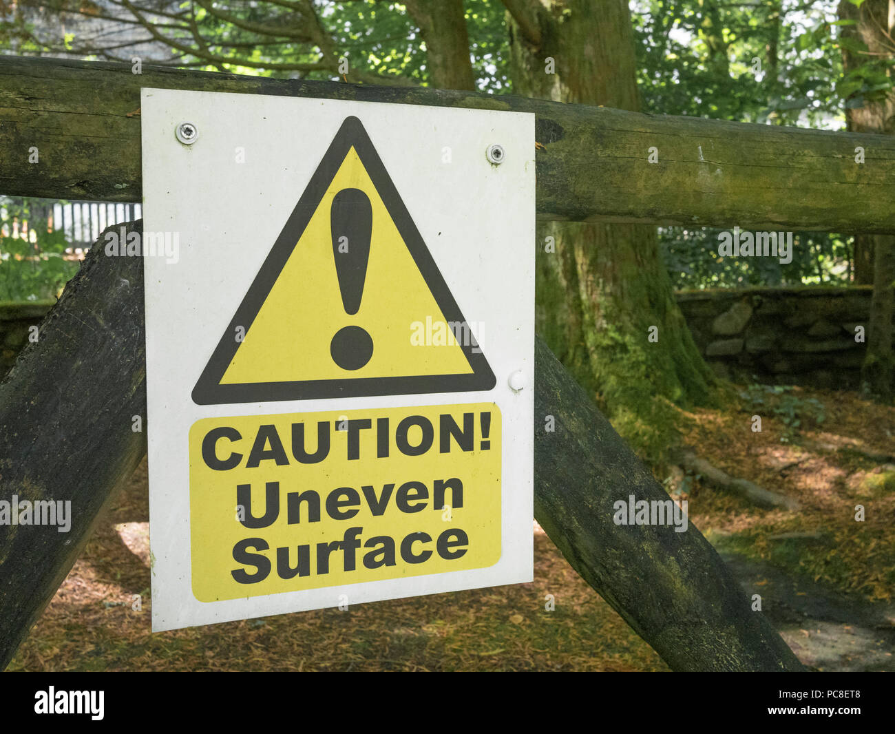 Yellow triangular hazard warning sign with exclamation mark Stock Photo