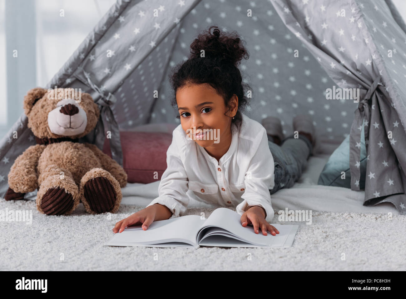 Black girl lying tent hi-res stock photography and images - Alamy