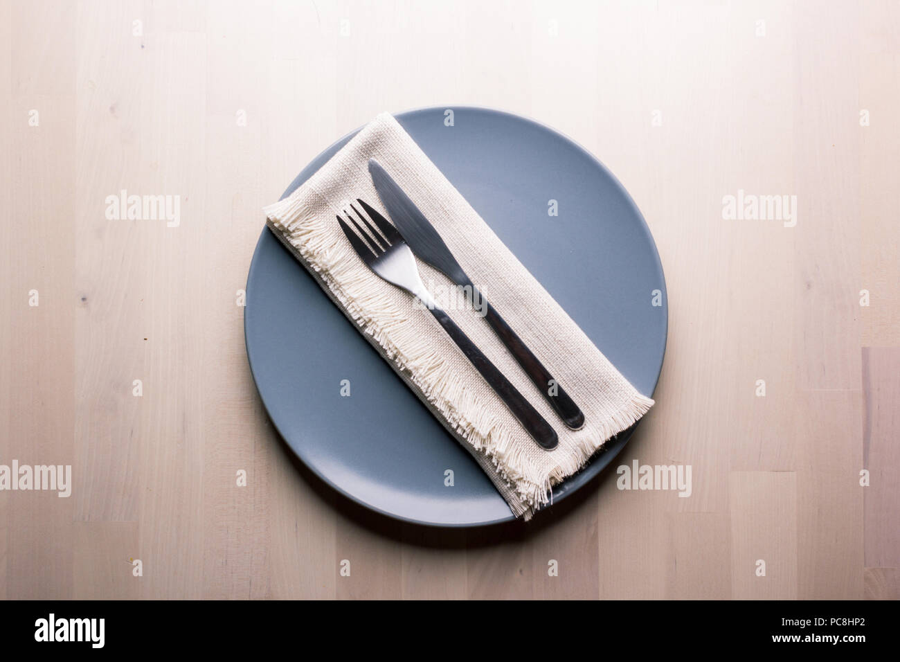 Top view of a restaurant table with plate, knife and fork, restaurant concept Stock Photo