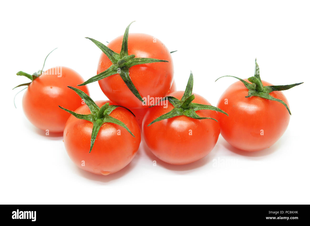 Red cherry tomato isolated on white background Stock Photo - Alamy