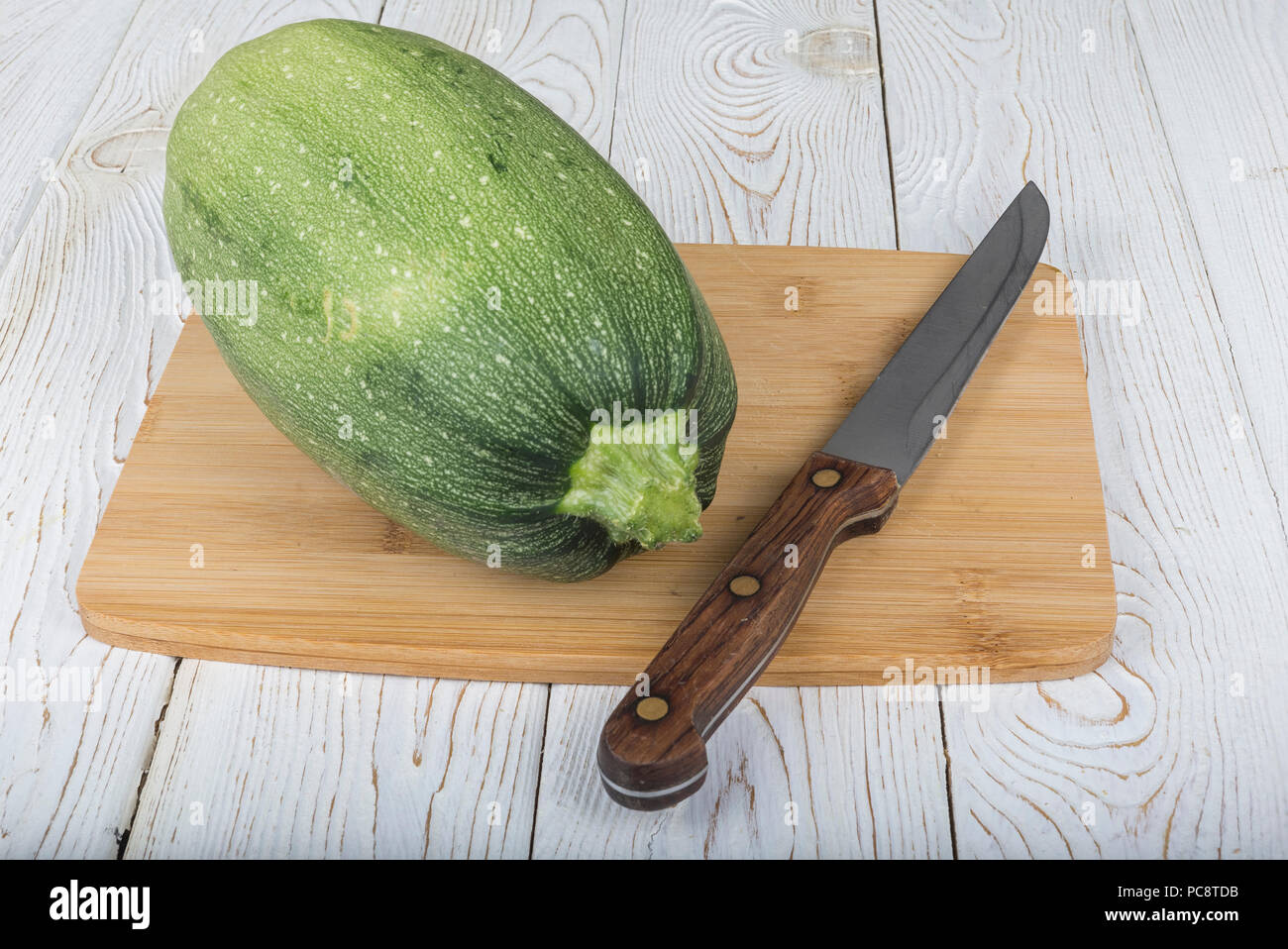 Vegetables (zucchini and patisson) on the board. Stock Photo