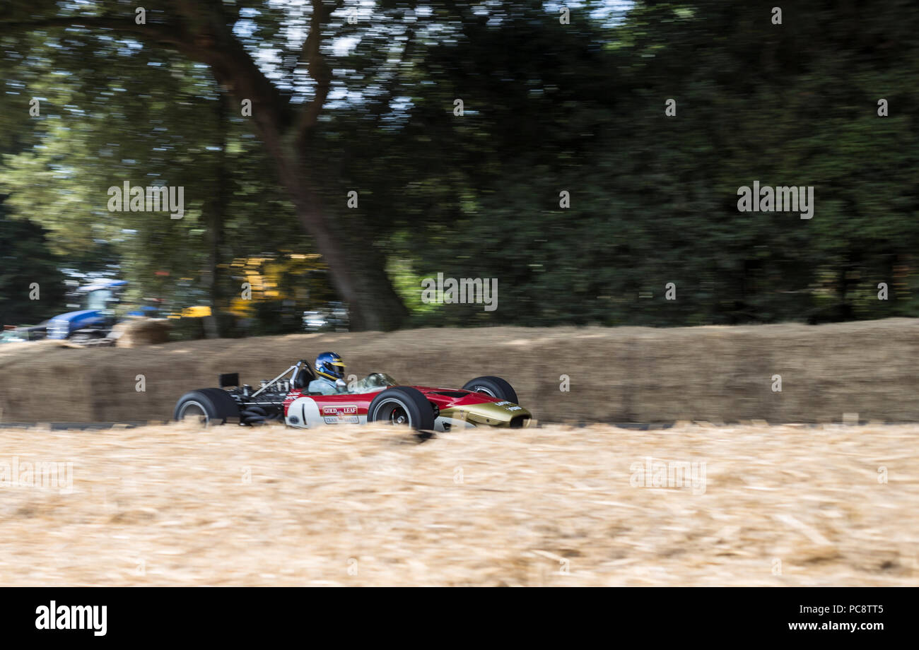 A Formula One car speeds up the Hillclimb at the Goodwood Festival of Speed 2018. Stock Photo