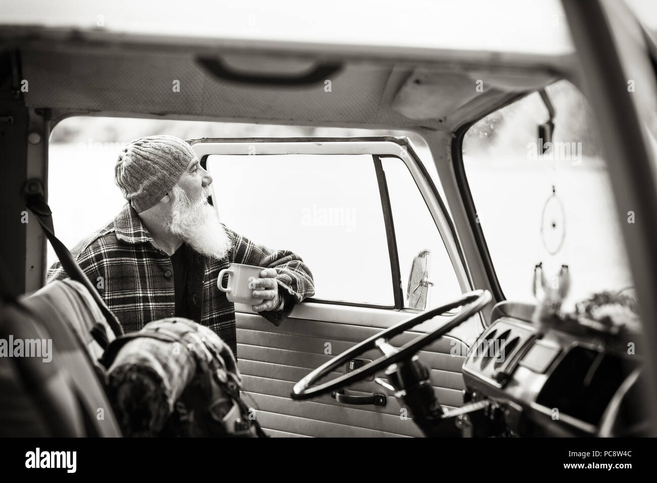 senior man near his pickup, ready for a hike in the woods Stock Photo