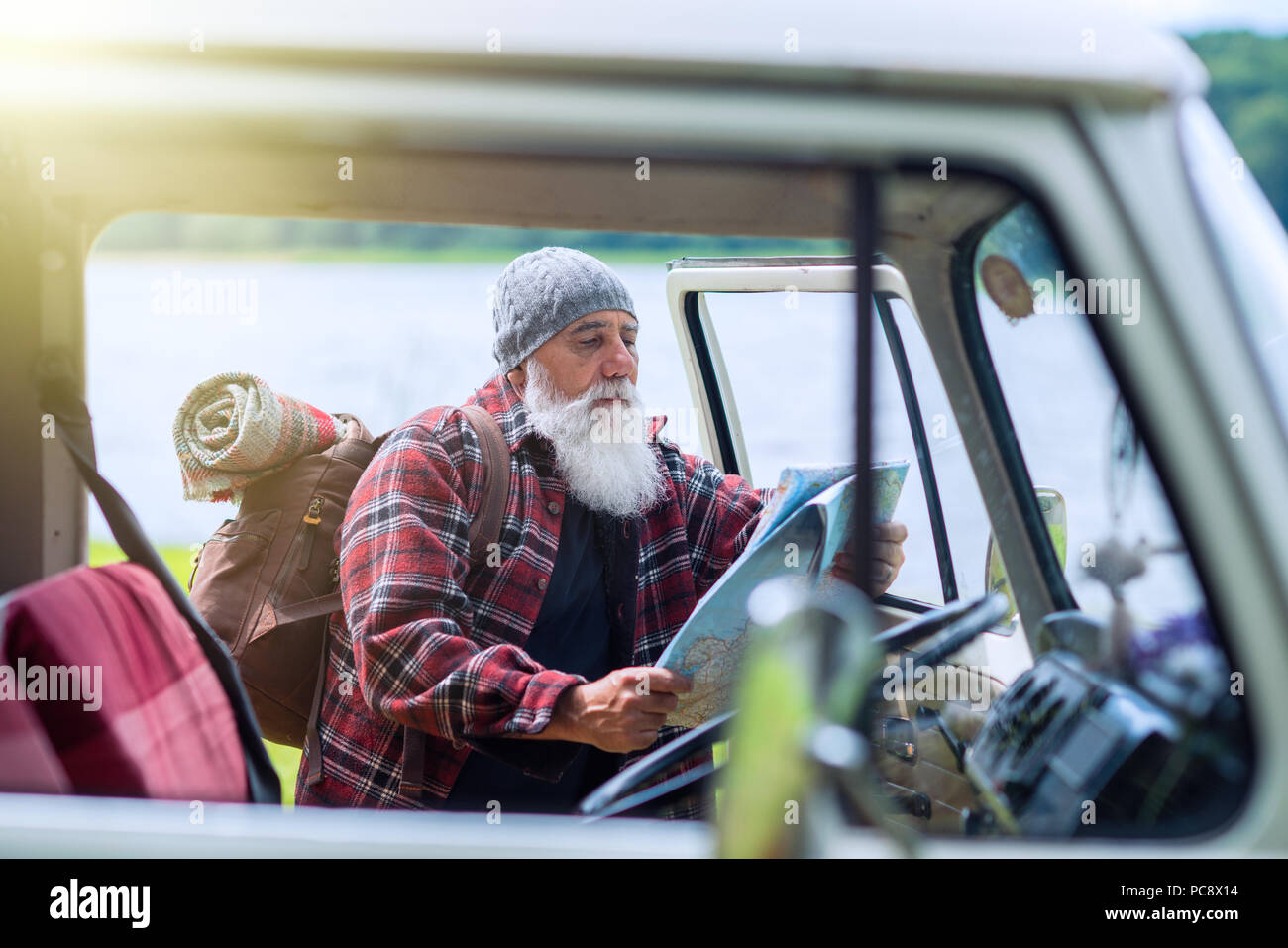 senior man near his pickup, ready for a hike in the woods Stock Photo