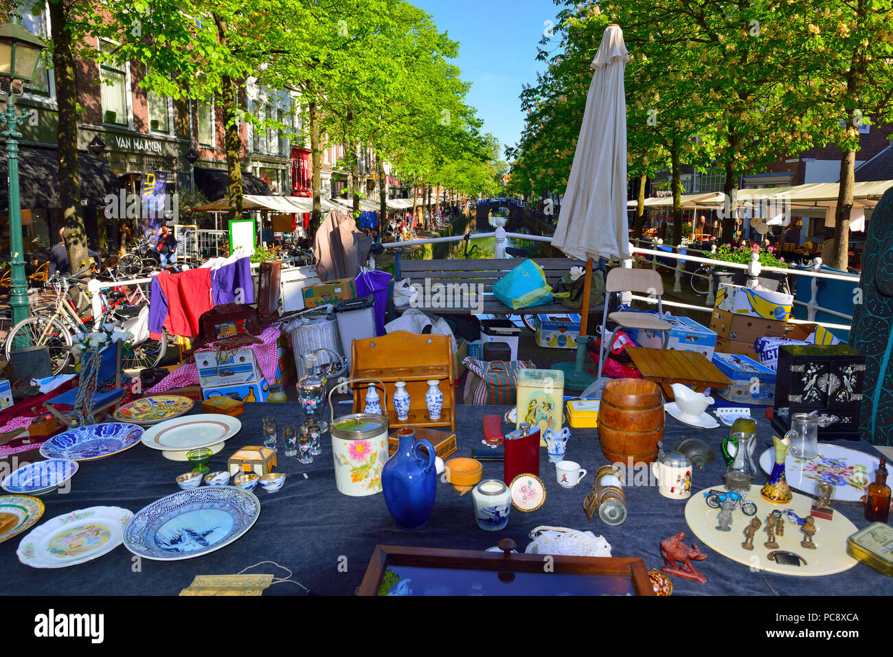 The famous outdoor street market in Delft which lines the canalside ...