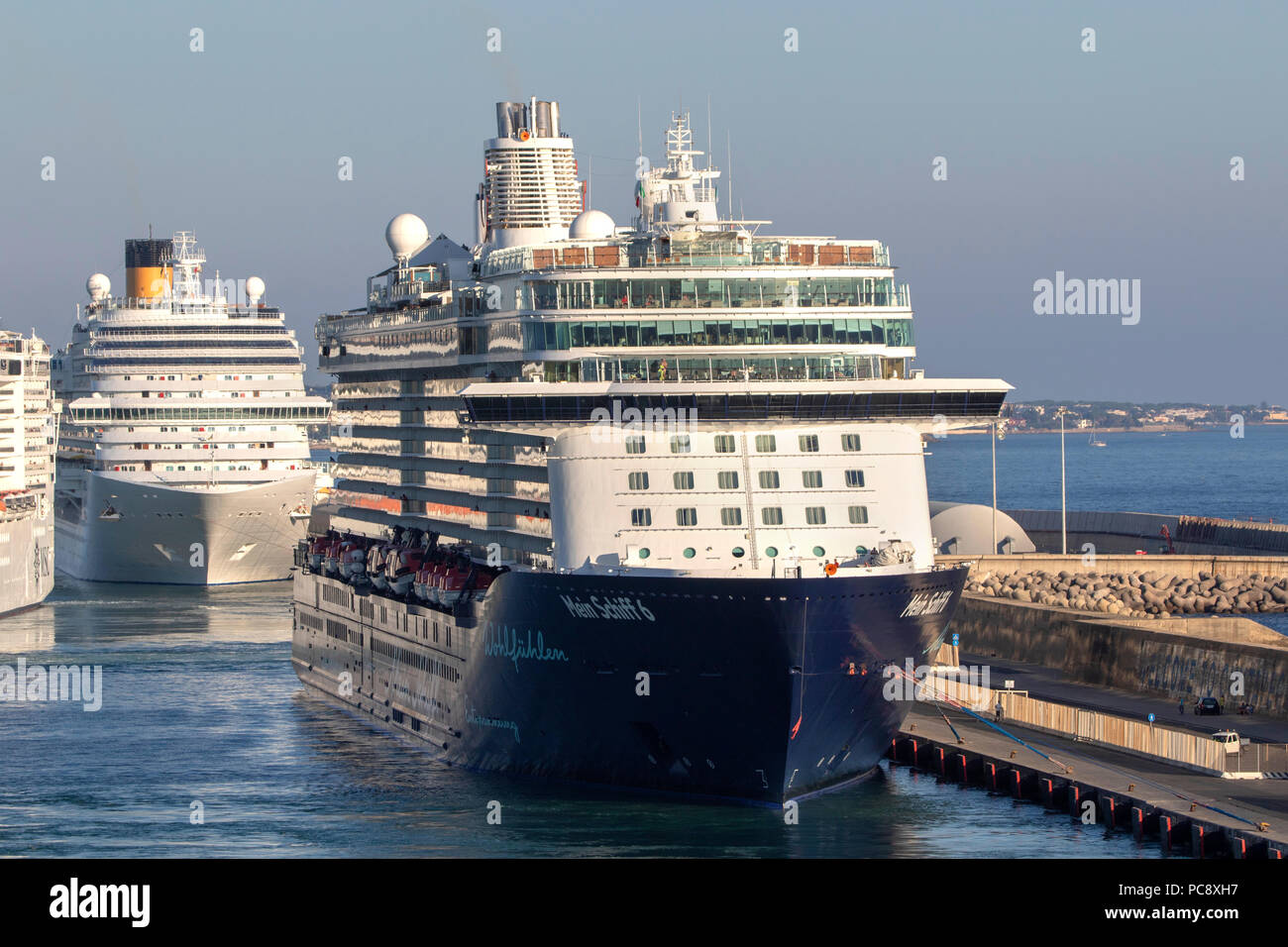 MSC Fantasia cruise ship owned by MSC Cruises, Mein Schiff 6 cruise ship owned by TUI Cruises and Costa Diadema all 3 seen at Civitavecchia in Italy Stock Photo