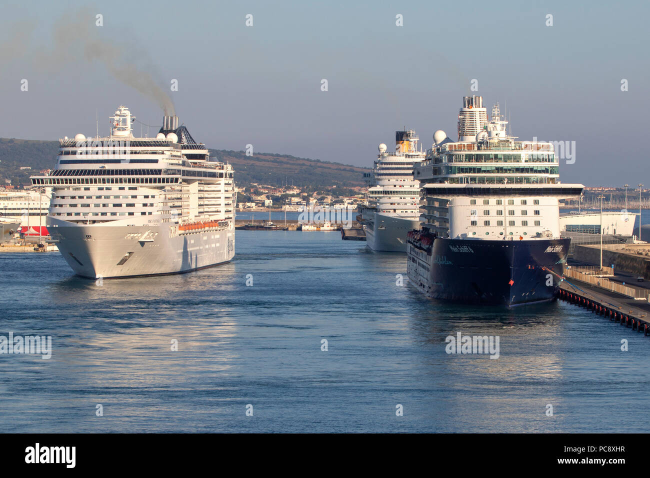 MSC Fantasia cruise ship owned by MSC Cruises, Mein Schiff 6 cruise ship owned by TUI Cruises and Costa Diadema all 3 seen at Civitavecchia in Italy Stock Photo