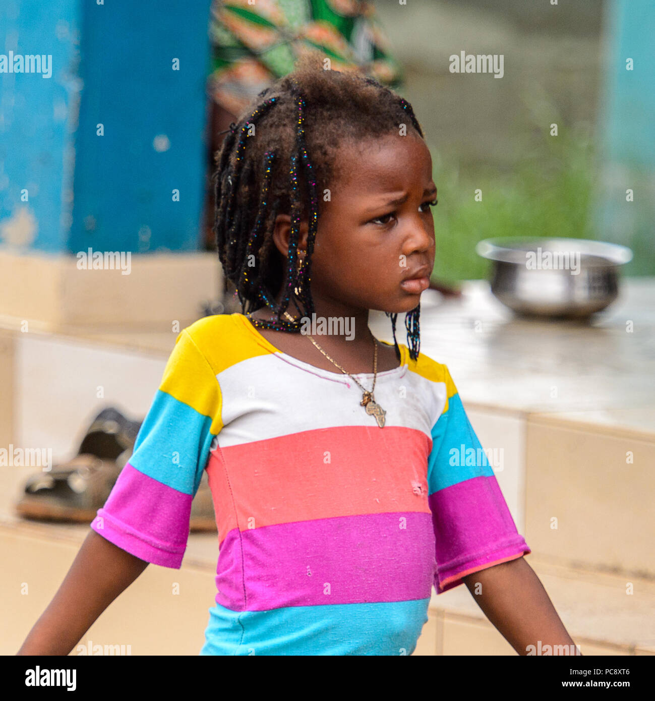 GANVIE, BENIN - JAN 11, 2017: Unidentified Beninese little beautiful girl  witl long hair in a village over the lake Nokwe. Benin children suffer of  po Stock Photo - Alamy