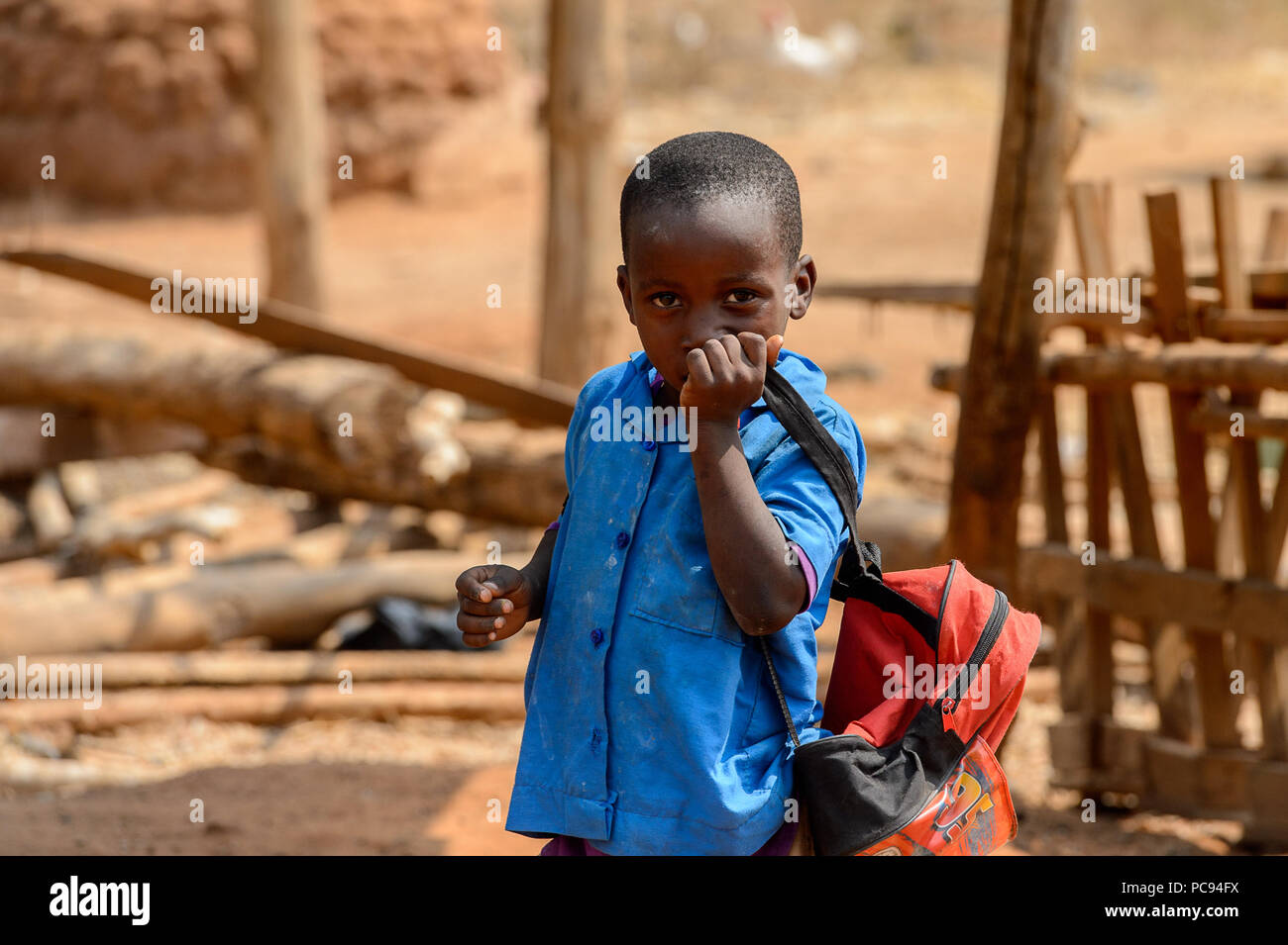 PIRA, BENIN - JAN 12, 2017: Unidentified Beninese boy in a blue school  uniform. Benin kids suffer of poverty due to the bad economy Stock Photo -  Alamy