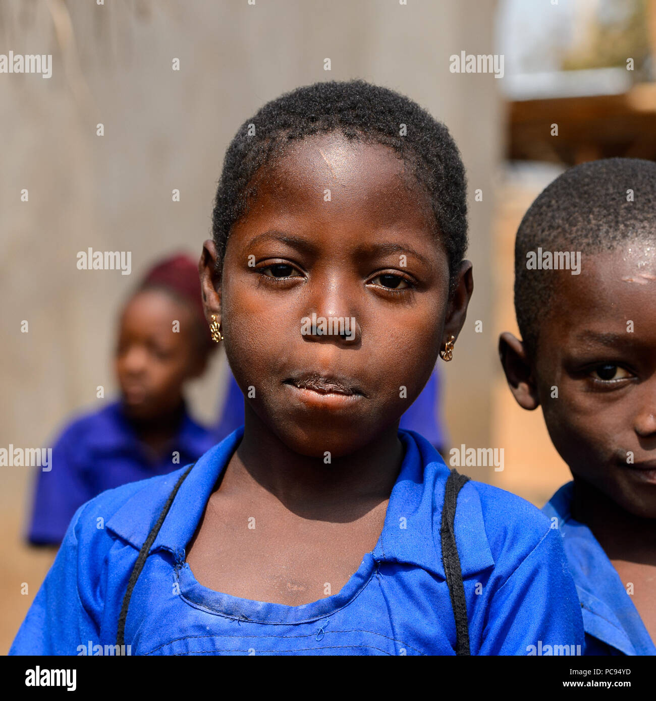 PIRA, BENIN - JAN 12, 2017: Unidentified Beninese little girl in a blue