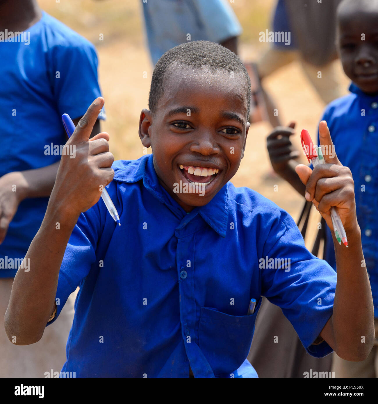 PIRA, BENIN - JAN 12, 2017: Unidentified Beninese little boy with pen