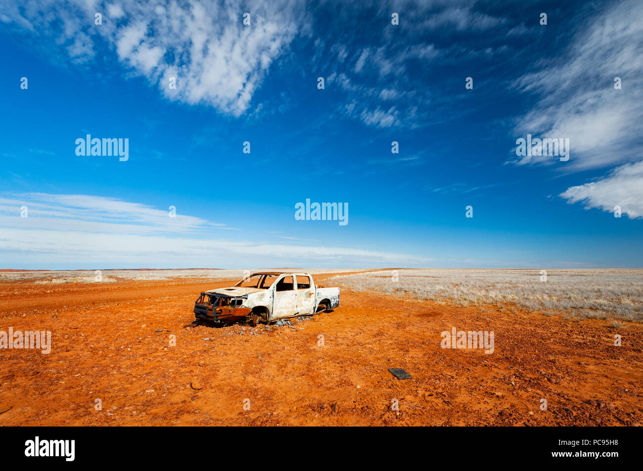 Car wreck beside a track in Strzelecki Desert. Stock Photo