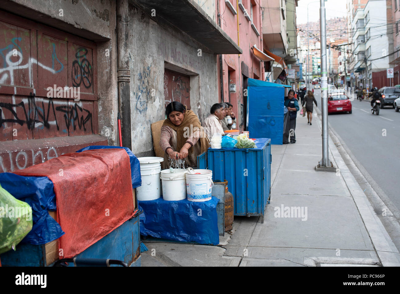 Street food vendor cleaning up after lunch time. Jun 2018 Stock Photo