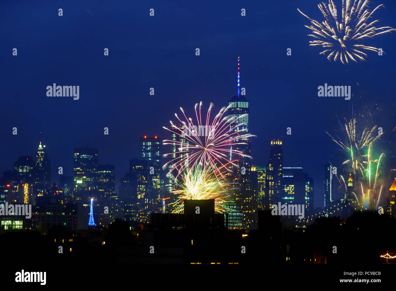 NEW YORK CITY - JUL 4: Independence Day fireworks above the Manhattan skyline Stock Photo