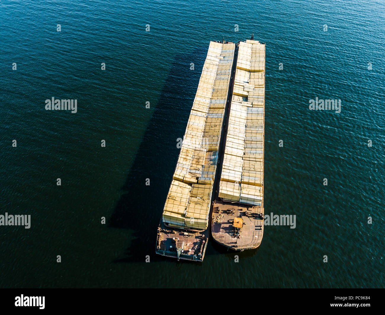 aerial view shipping cargo with containers isolated on the sea water ...