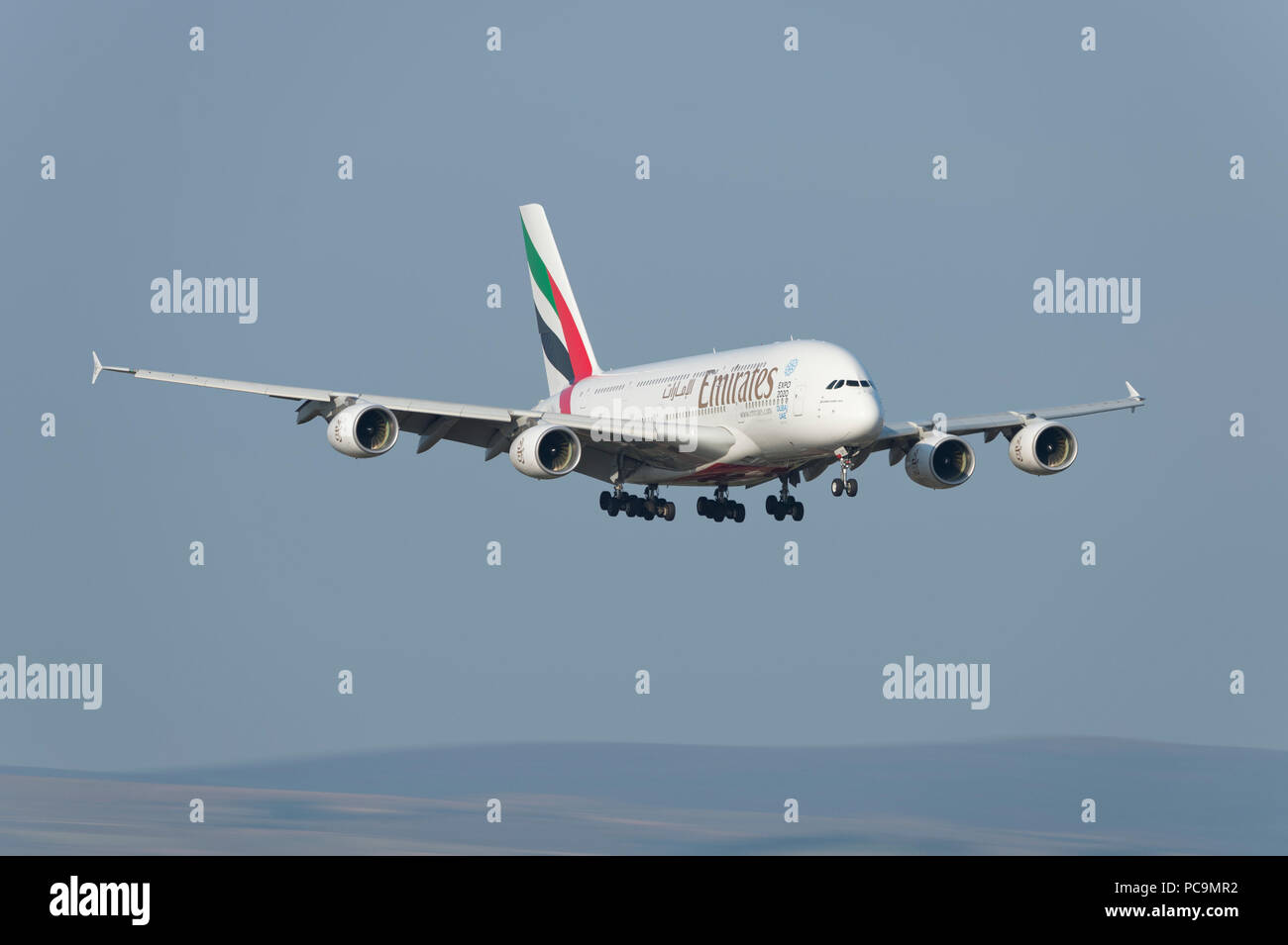 An Emirates Airbus A380-861 comes in to land at Manchester Airport, UK. Stock Photo