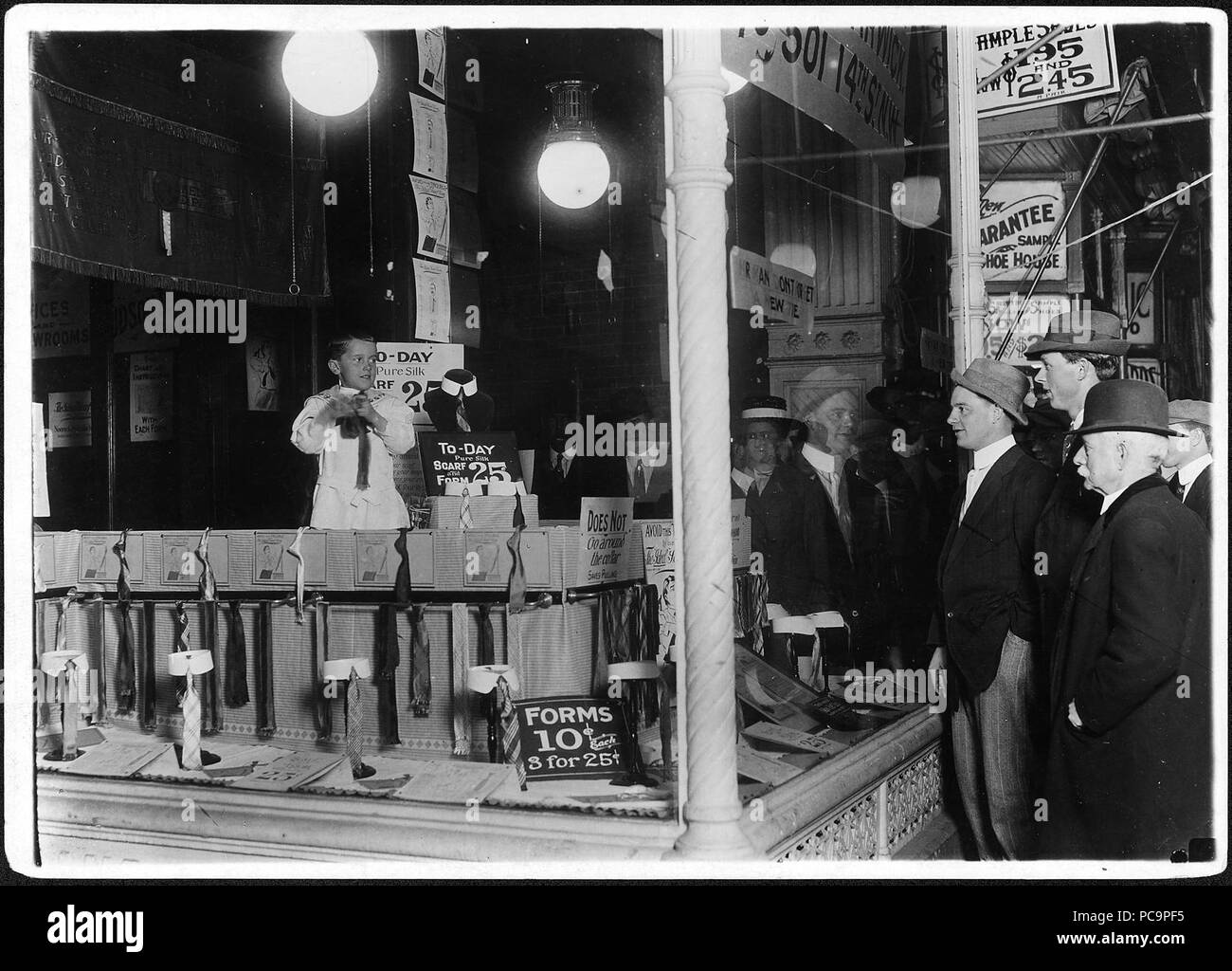 After 9 P.M., 7 year old Tommie Nooman demonstrating the advantages of