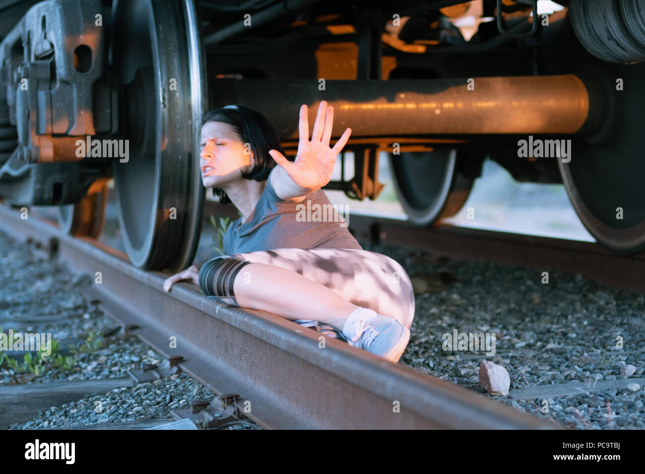view-under-the-moving-train-with-escaping-girl-stock-photo-alamy
