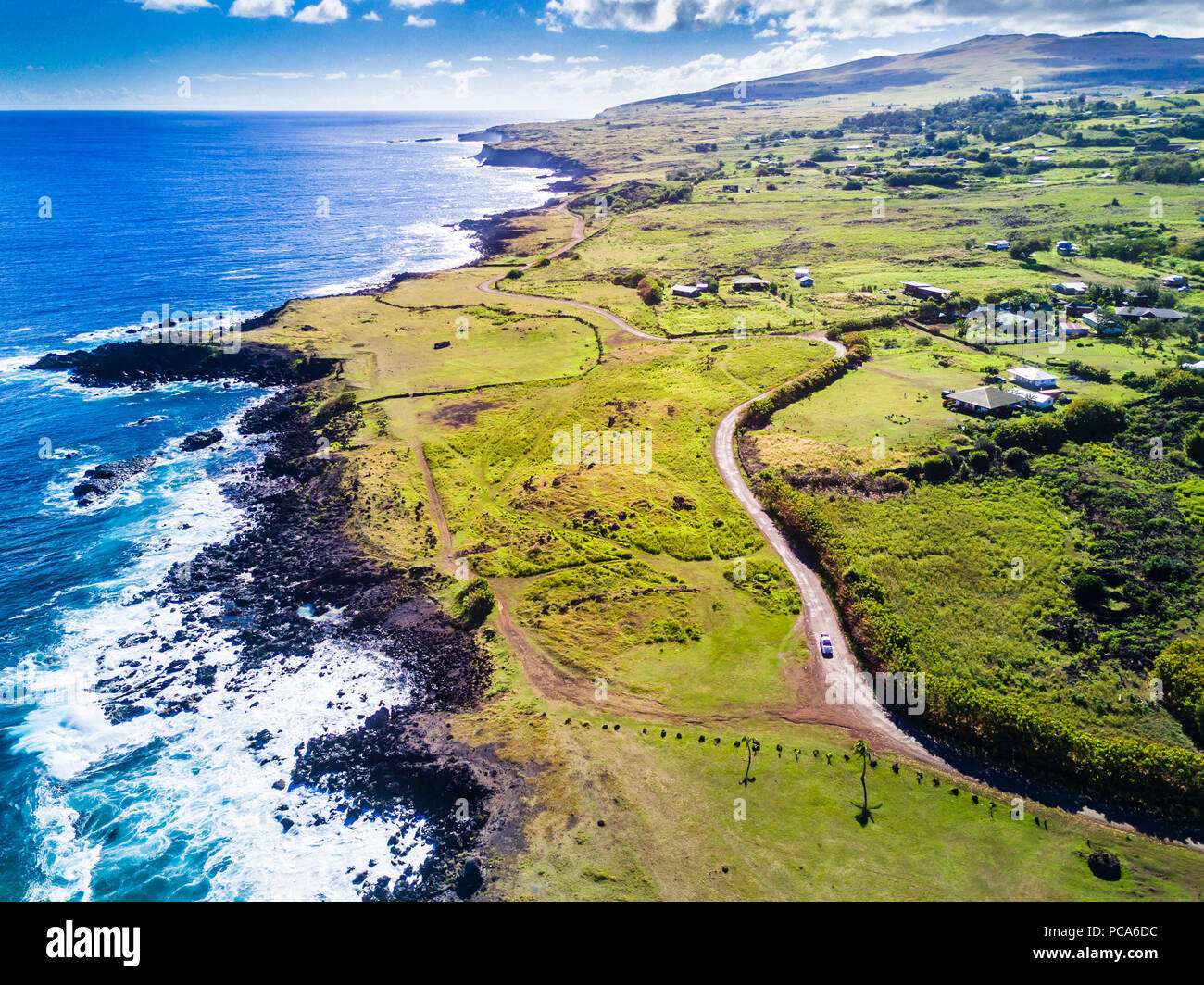 An aerial view to the north on the west coast of Easter Island at its town Hanga Roa viewing a wonderful coastline, Rapa Nui, Chile Stock Photo