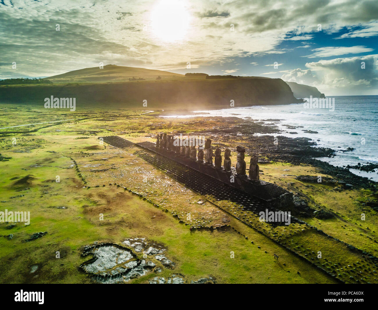 An aerial view over Ahu Tongariki, the most amazing Ahu platform on Easter Island. 15 moais still stand up at the south east of the Island. Ahu Tongar Stock Photo