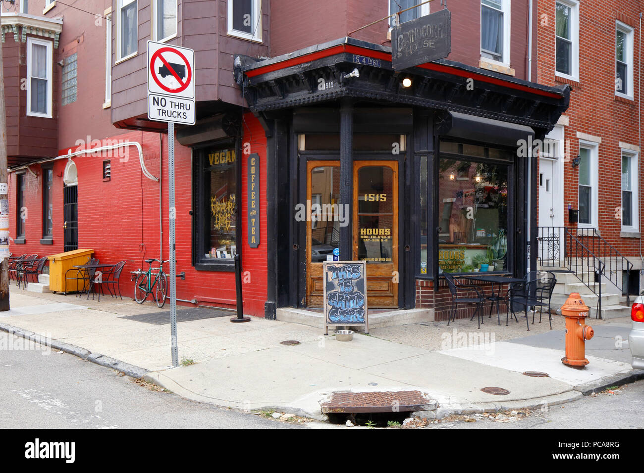 Grindcore House, 1515 S 4th St, Philadelphia, PA. exterior storefront of a vegan coffee shop, and sidewalk cafe in dickenson square Stock Photo