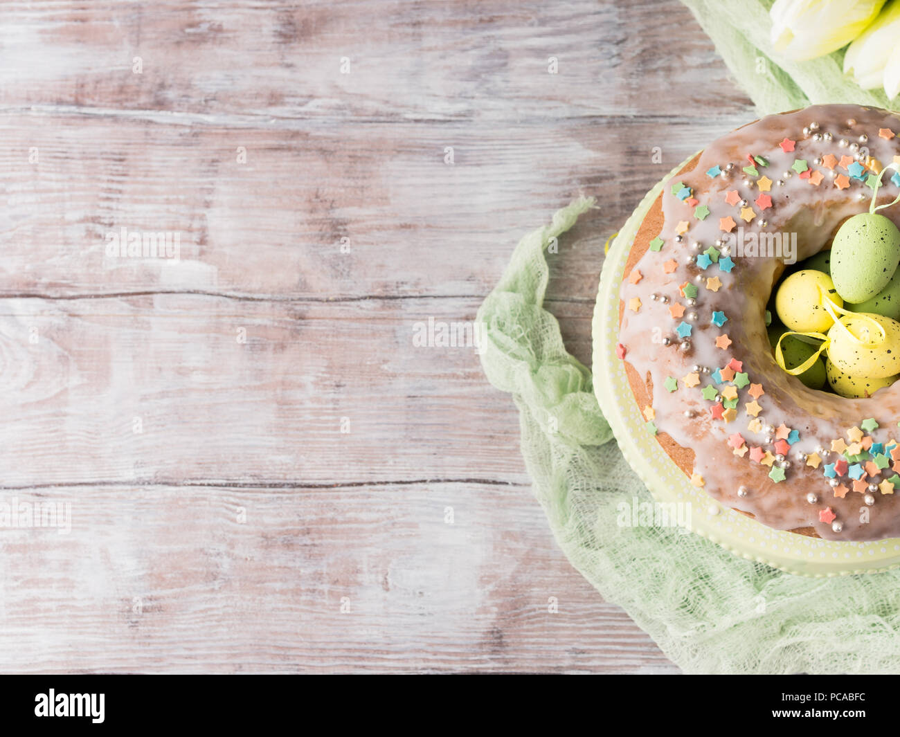 Easter ring cake with decorative festive eggs and sprinkles Stock Photo ...