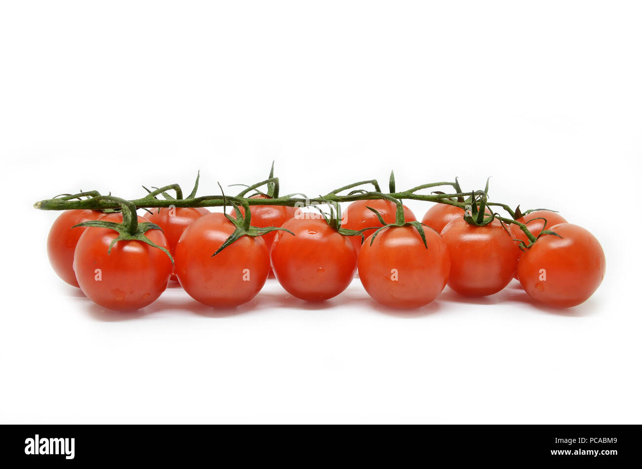 Red cherry tomato isolated on white background Stock Photo - Alamy
