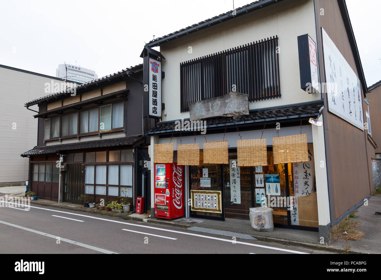 Traditional food store with coca-cola vending machine outdoors, in the city of Kanazawa in Japan Stock Photo