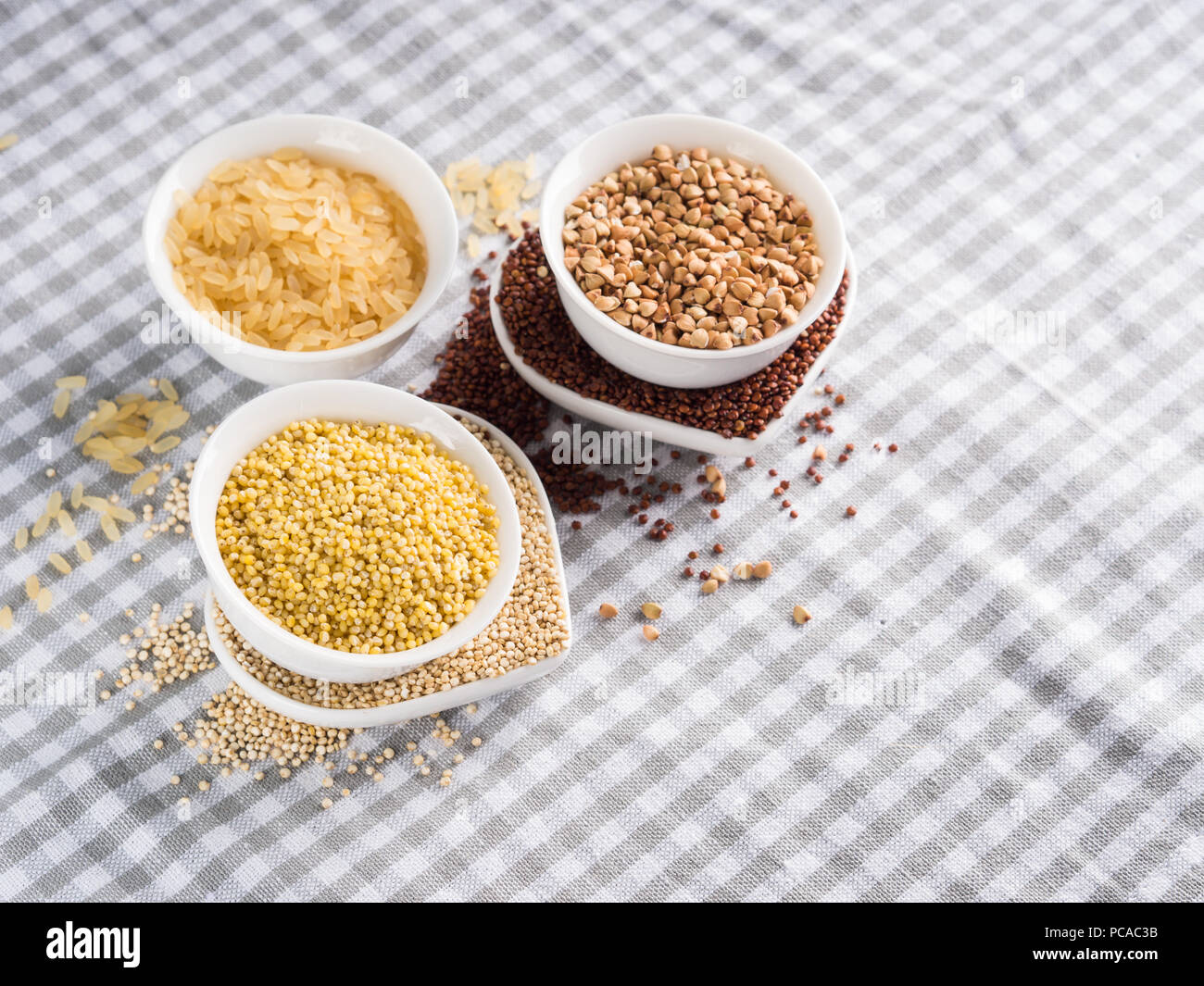 Gluten free grains quinoa, rice, buckwheat, amaranth, millet in bowls