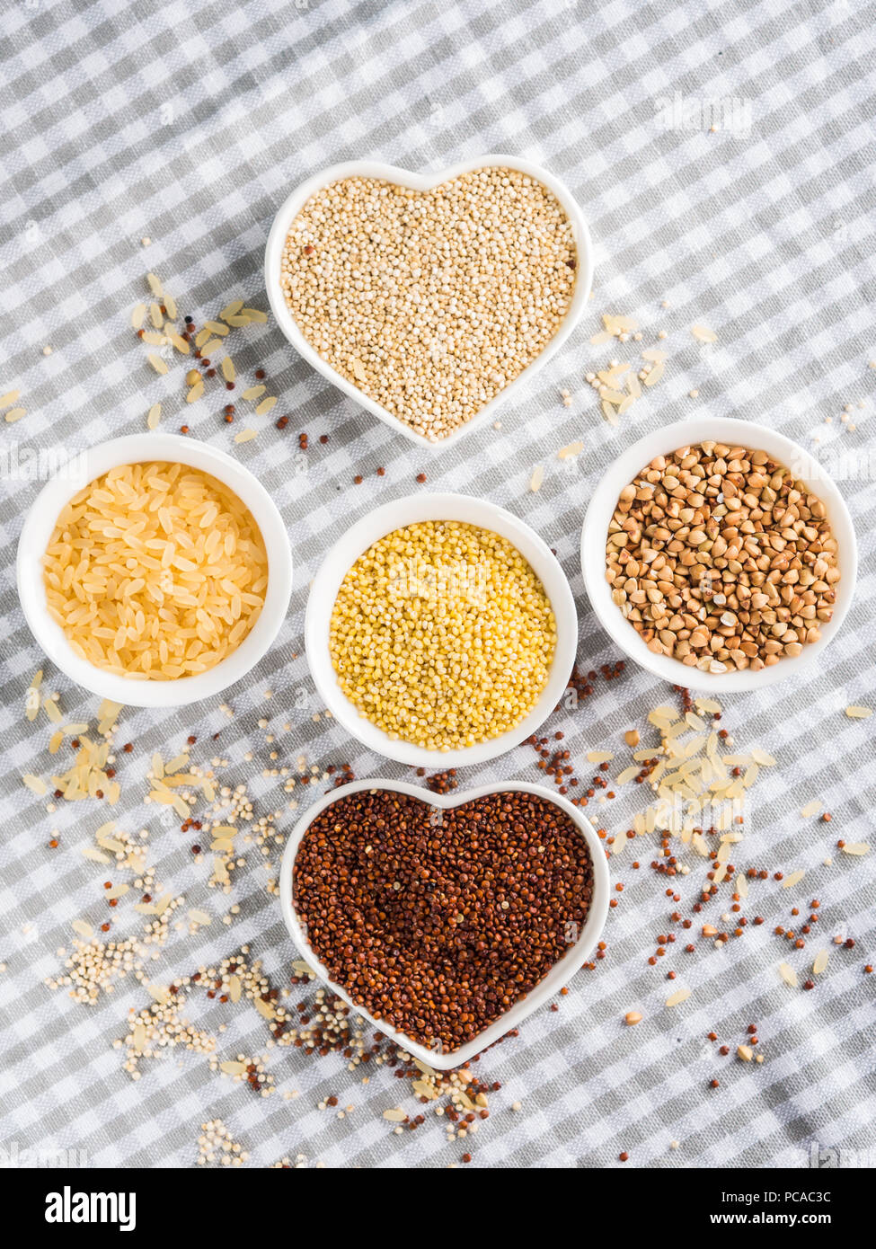 Gluten free grains quinoa, rice, buckwheat, amaranth, millet in bowls