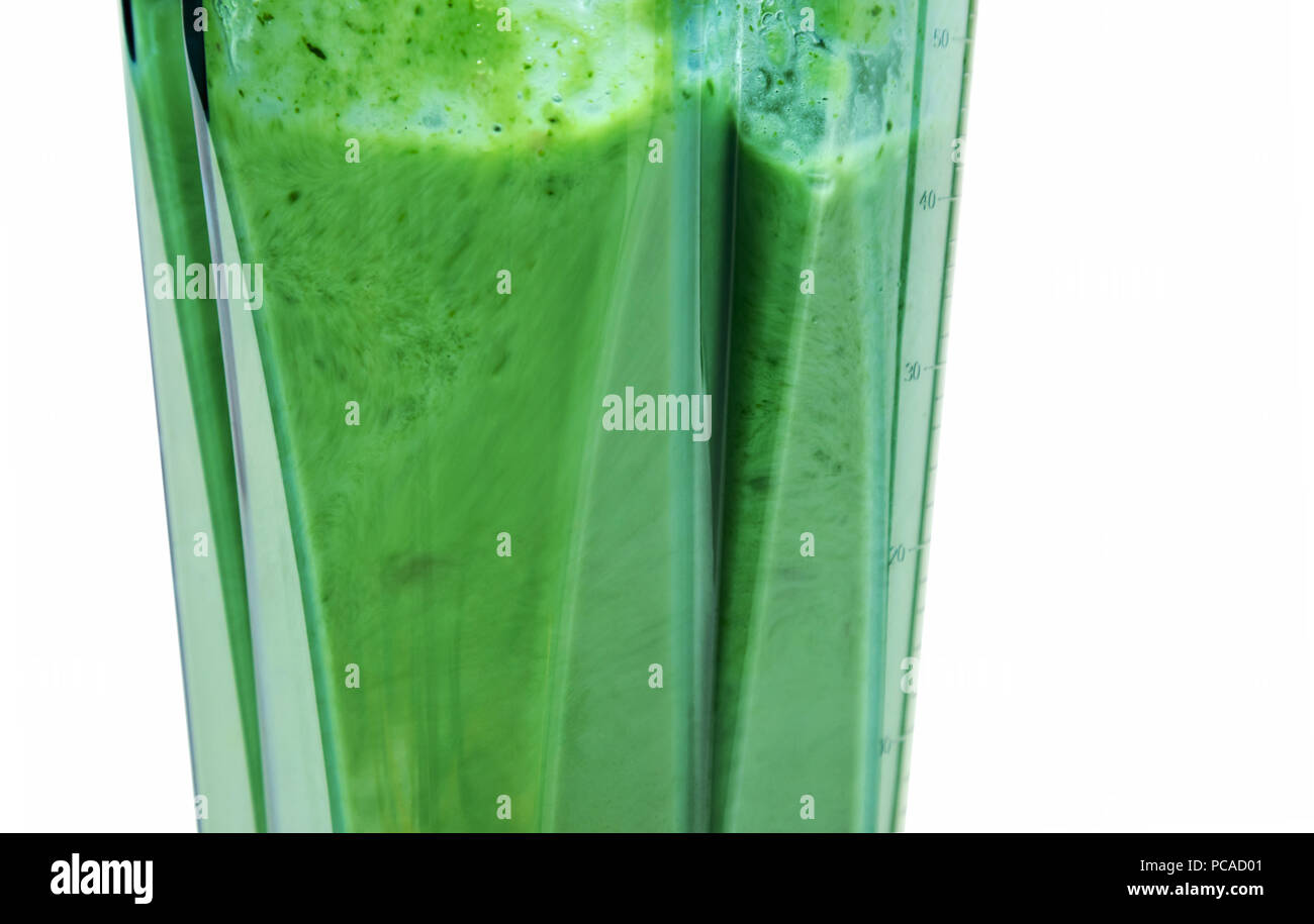 Green smoothie. Blending ingredients for green smoothie. Stock Photo