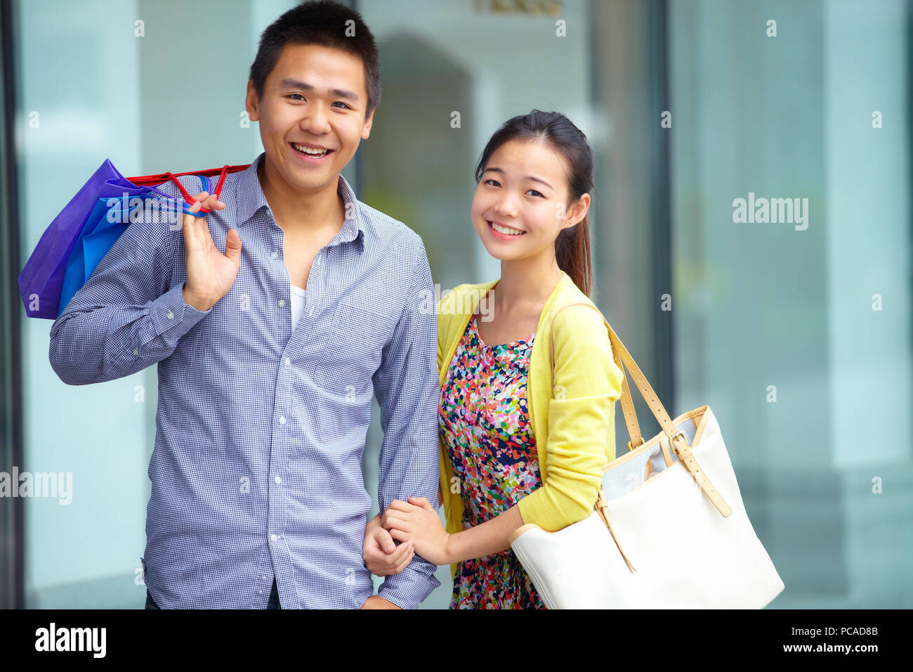 happy young Chinese couple shopping Stock Photo - Alamy