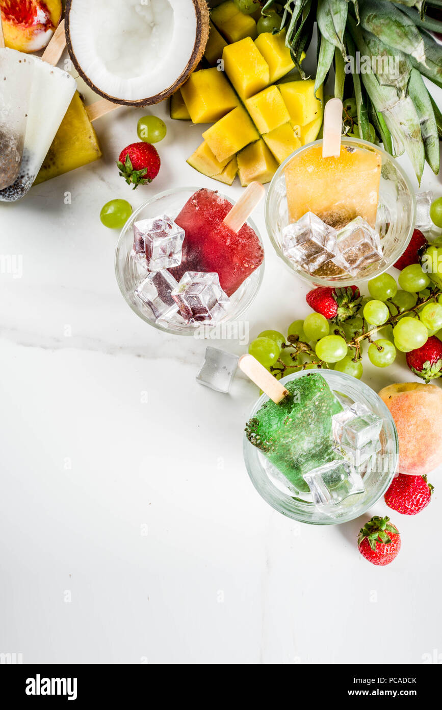 Tropical ice cream popsicles with chia seeds and fruit juices
