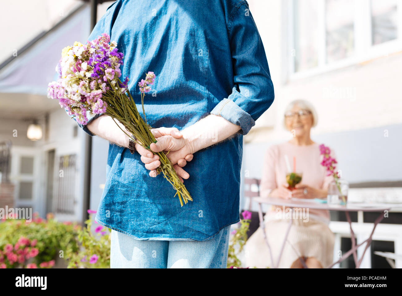 Romantic kind man preparing surprise Stock Photo