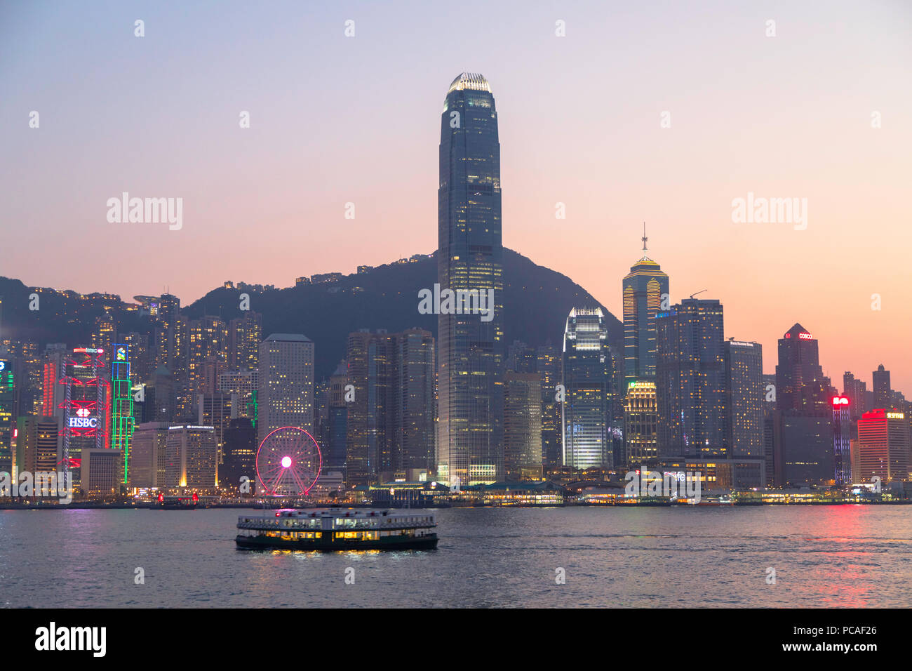 Star Ferry in Victoria Harbour at dusk, Hong Kong Island, Hong Kong, China, Asia Stock Photo