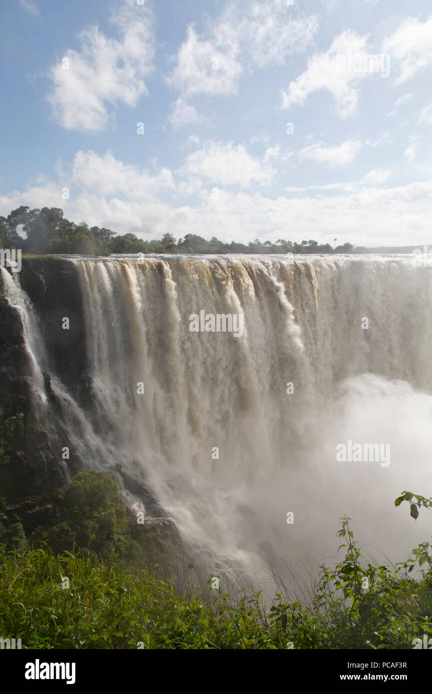 The River Zambezi crashes over the Victoria Falls waterfall (Mosi-oa-Tunya), UNESCO World Heritage Site, on the border of Zimbabwe and Zambia, Africa Stock Photo
