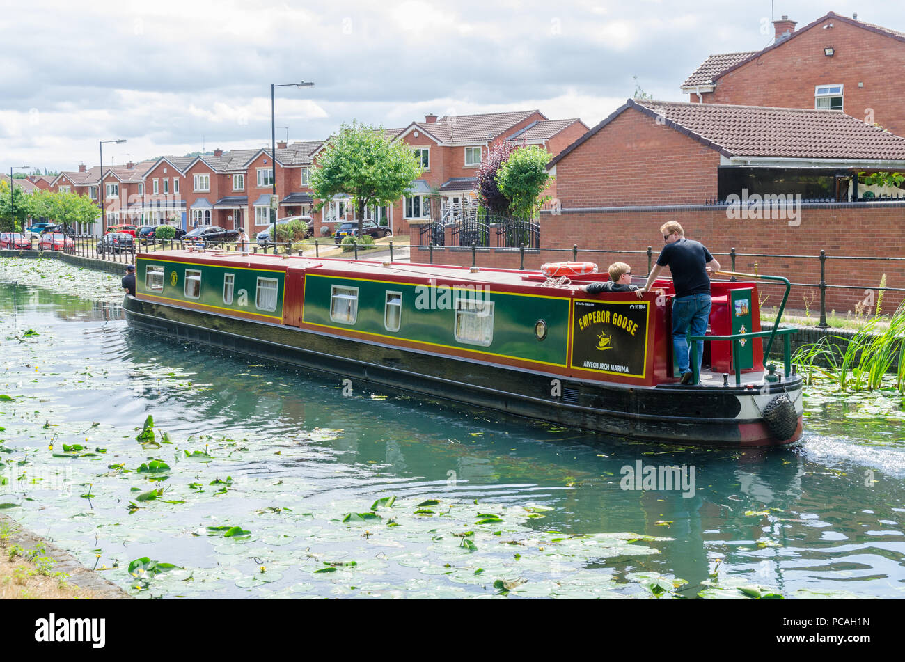 The Birmingham Canal in Tipton, Dudley which runs between Birmingham and Wolverhampton with water lilies growing in the unpolluted water Stock Photo