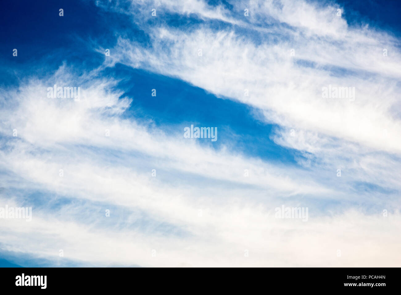 Large Cumulus Clouds in the sky in a sunny day, clear and windy. Grandes cúmulos de nubes en el cielo de un día soleado y ventoso. Stock Photo