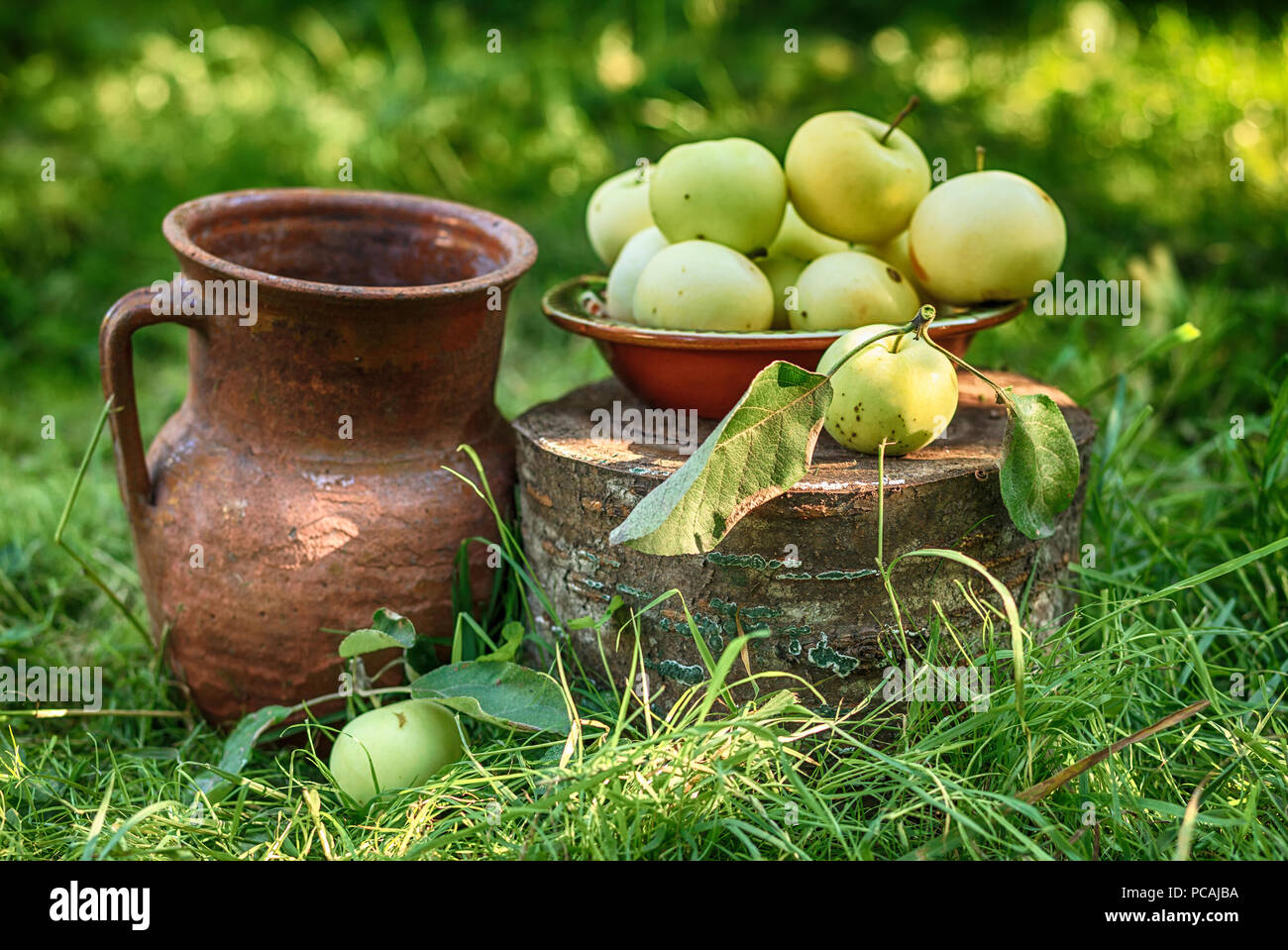 Apples with pitcher, still life. Stock Photo