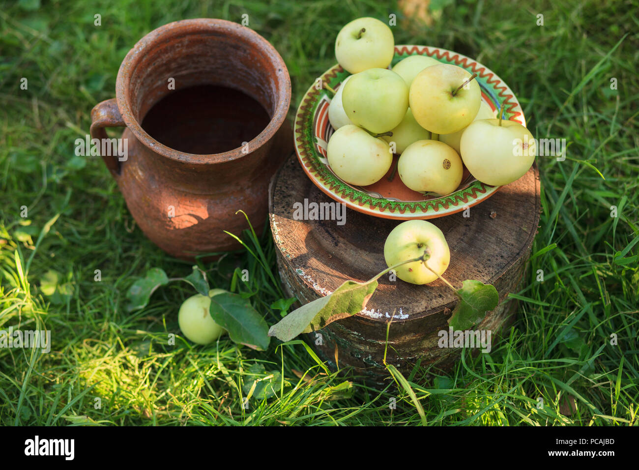 Apples with pitcher, still life. Autumn still life. Stock Photo